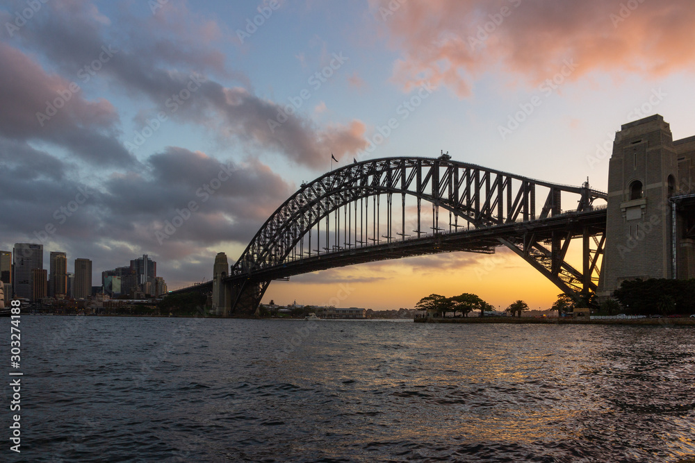 Naklejka premium Sydney Harbour Bridge at sunset time, view from Kirribilli, Australia