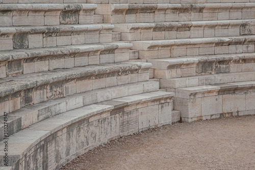 restored ancient amphitheater with stone seats