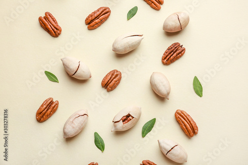 Tasty pecan nuts on light background
