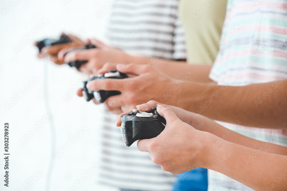 Teenagers playing video games, closeup