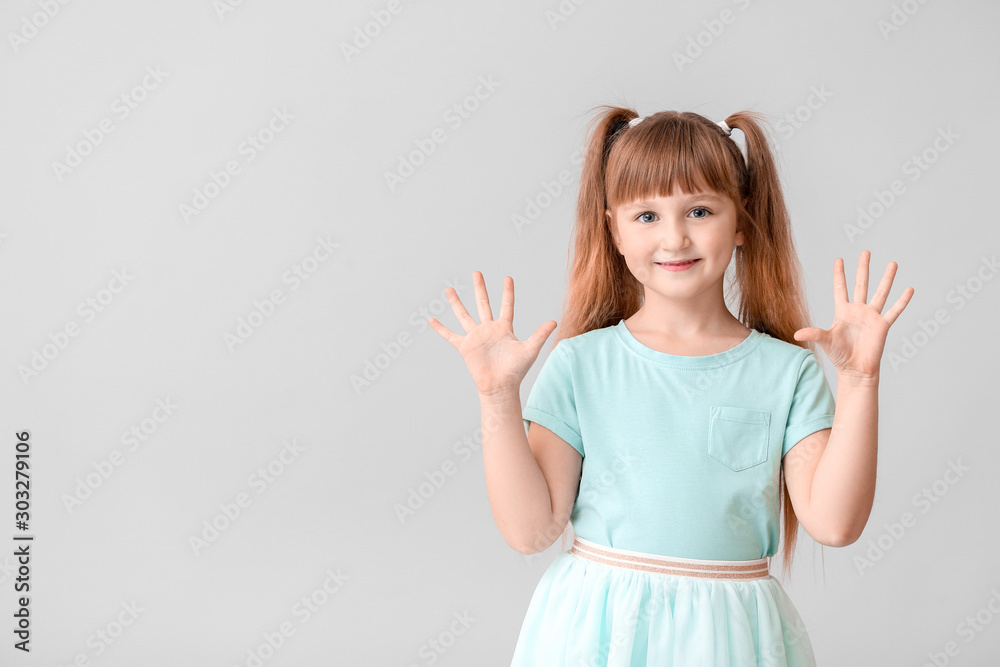 Cute little girl on light background Cute little girl on light background