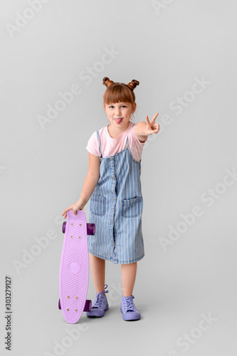 Cute little girl with skate...
