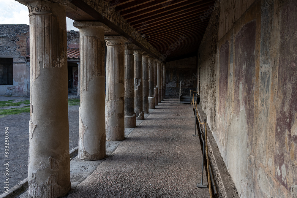 ruins of buildings and columns in Pompeji city near neapel, italy