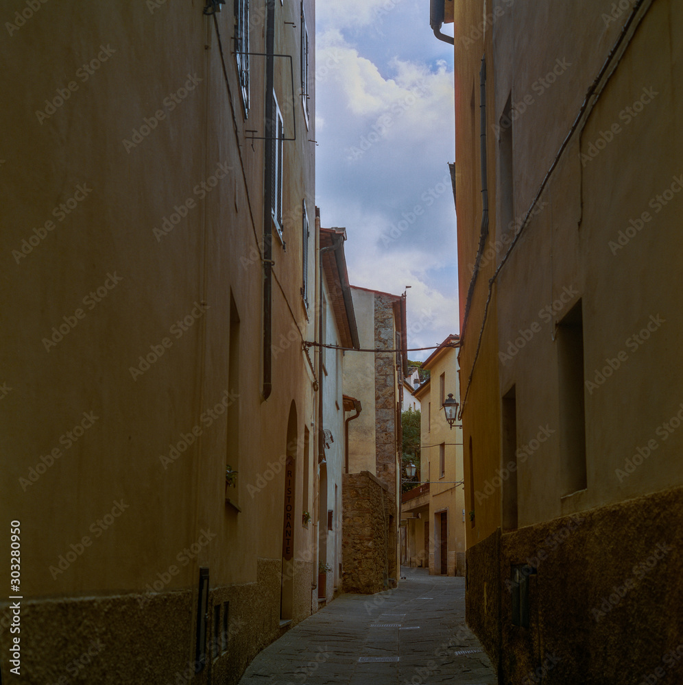 The old narrow streets in the medieval town of Massa Marittima in Tuscany shot with analogue film technique - 7