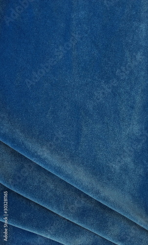 velvet texture classic blue color background, expensive luxury fabric, wallpaper. copy space