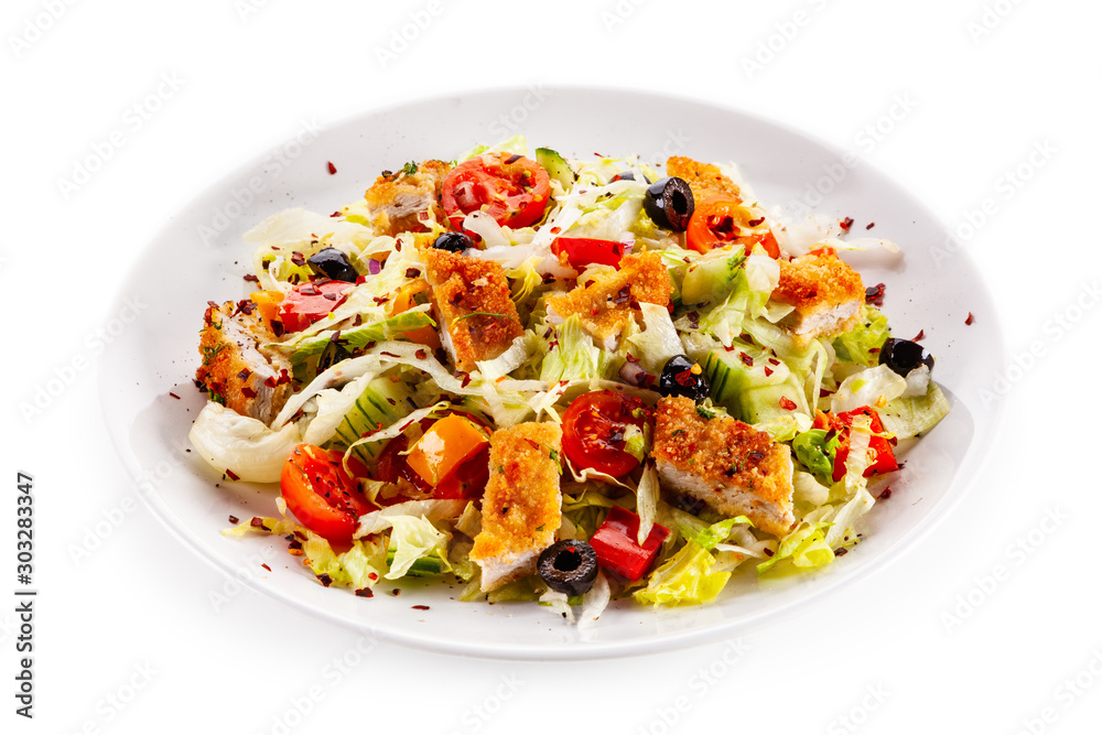 Salad with chicken meat and vegetables on white background Salad with chicken meat and vegetables on white background