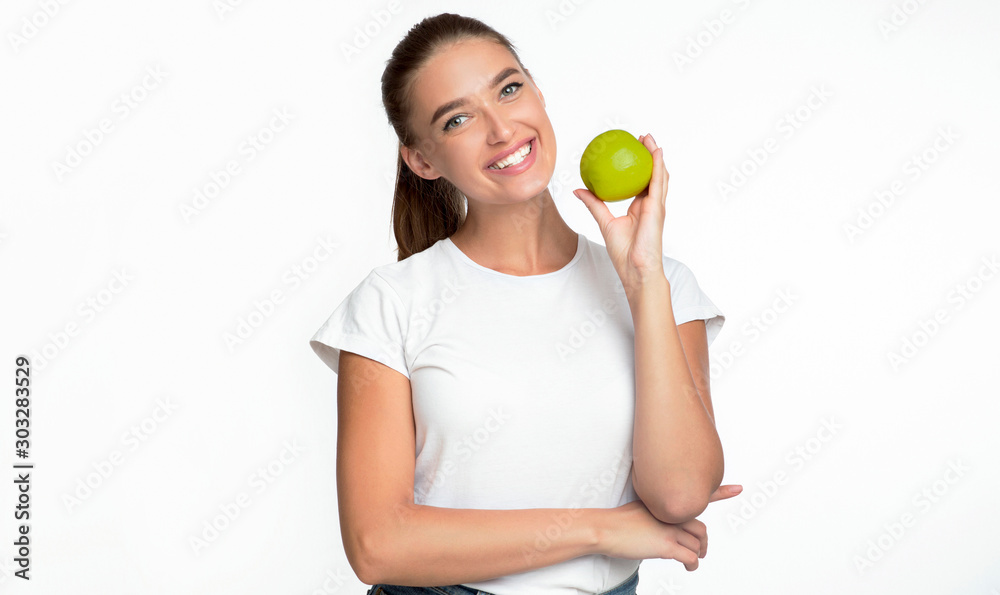 Woman Holding Apple Smiling Posing On White Background Woman Holding Apple Smiling Posing On White Background