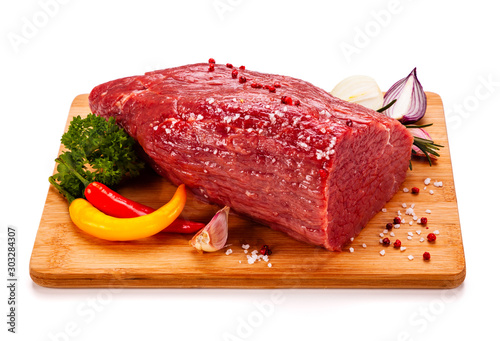 Fresh raw beef on cutting board on white background