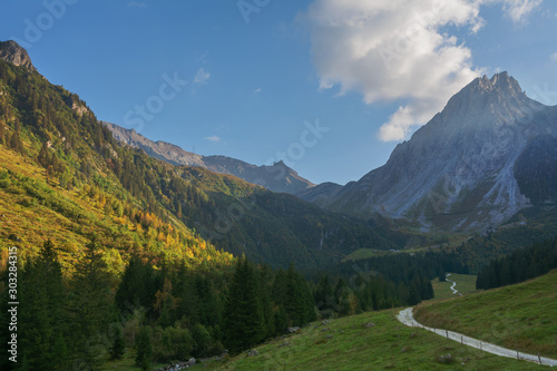 Fantastic trekking of the beautiful French Alps with majestic peaks of rocky mountains.