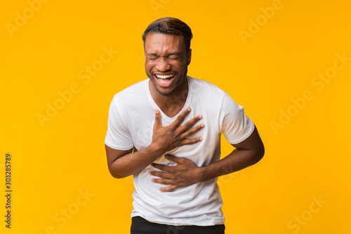 Fotografie, Obraz Black Man Standing Laughing Out Loud, Studio Shot