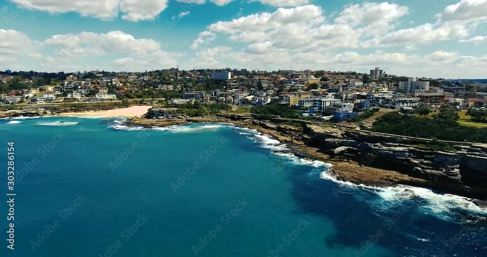 People Enjoying A Relaxing Walk On The Coastal Walk Of The Tamarama Beach In Sydney, Australia - Aerial Shot People Enjoying A Relaxing Walk On The Coastal Walk Of The Tamarama Beach In Sydney, Australia - Aerial Shot