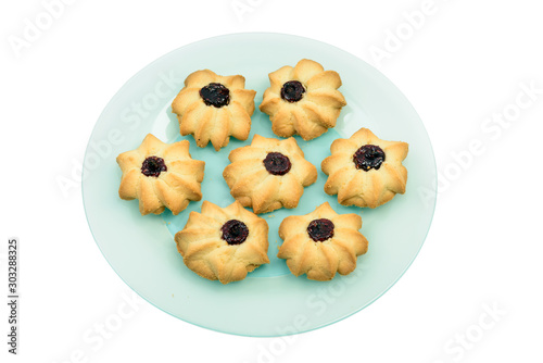 Group of homemade cookies with jam on plate isolated
