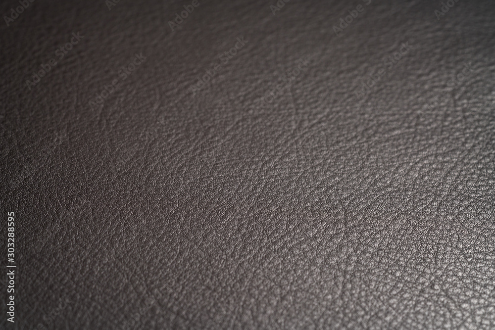 Closeup shot of full garin dark brown full grain leather Closeup shot of full garin dark brown full grain leather