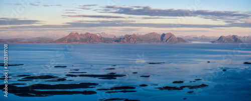 Panoramic View of Vestfjorden and Svellingsflaket islets from of the highest point of Arsteinen island of Lofoten archipelago in sunset time. Nordland, Norway.