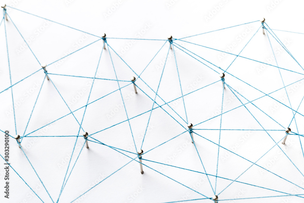  Communication, technology, network concept. Network with pinsA large grid of pins connected with string. Communication, technology, network concept. Network with pins