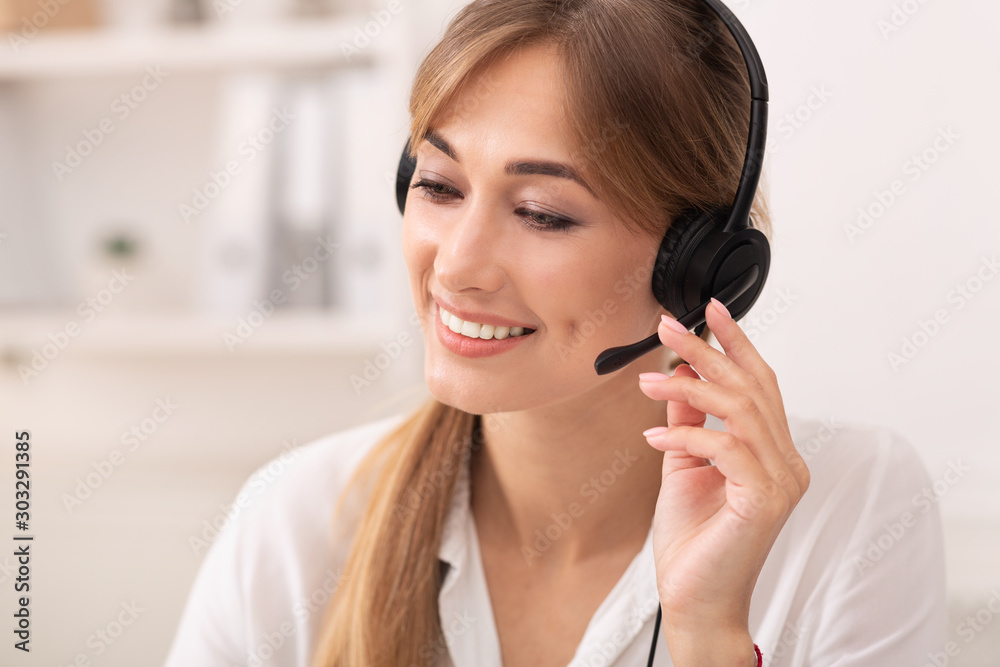 Call Center Worker In Headset Receiving Client's Feedback Sitting Indoor Call Center Worker In Headset Receiving Client's Feedback Sitting Indoor