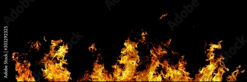 Real line of fire flames isolated on black background. Mockup on black of wall of fire. © Dancing Man