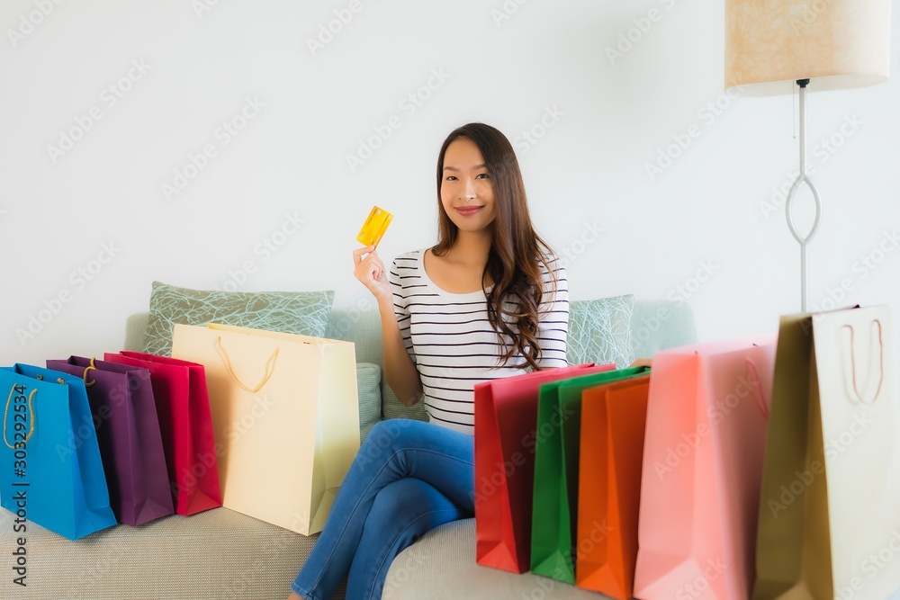 Portrait beautiful young asian women with credit card mobile phone or computer for shopping Portrait beautiful young asian women with credit card mobile phone or computer for shopping