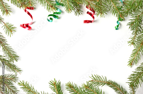 Christmas balls and branches on a light background