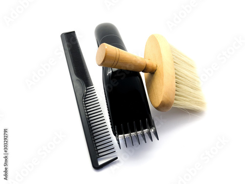 Barber machine, brush and comb isolated on a white background. Set hair clipper, brush and comb. Men's hairdresser tool kit for beauty salon.