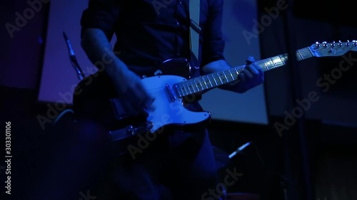 man playing electric guitar on stage - live music