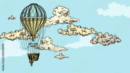 Turquoise antique air balloon in sky with clouds