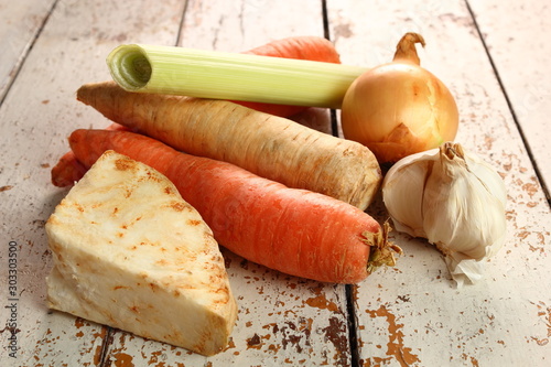 Vegetables to make broth: celery, carrot, parsley root, garlic, onion, leek. photo