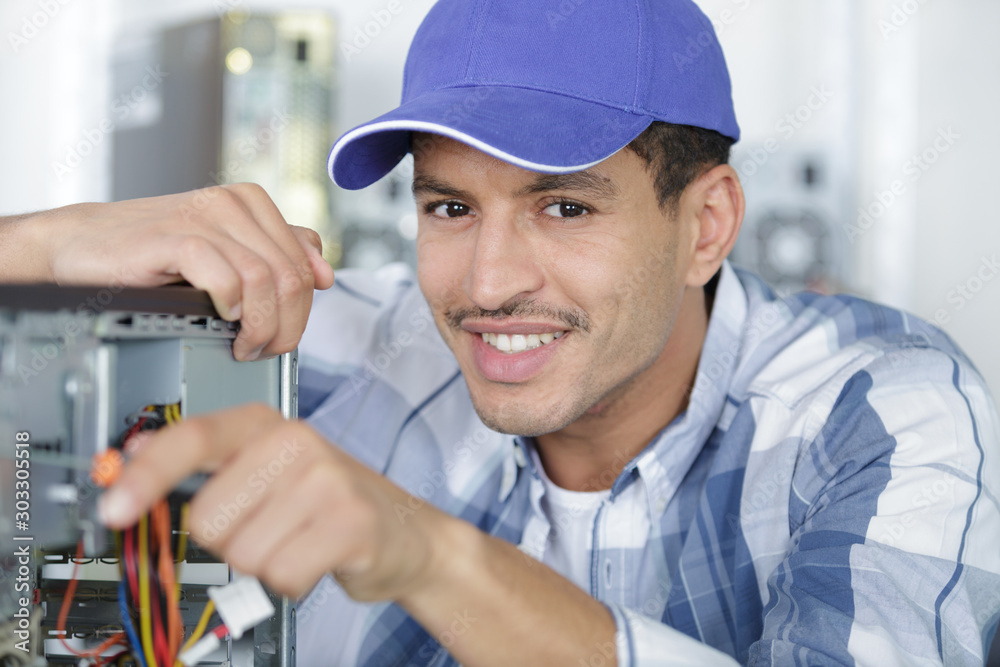 repairman working in technical support fixing computer laptop tr repairman working in technical support fixing computer laptop tr