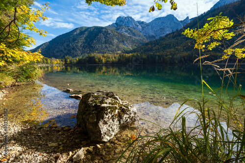 Peaceful autumn Alps mountain lake with clear transparent water and reflections. Langbathseen lake, Upper Austria. photo