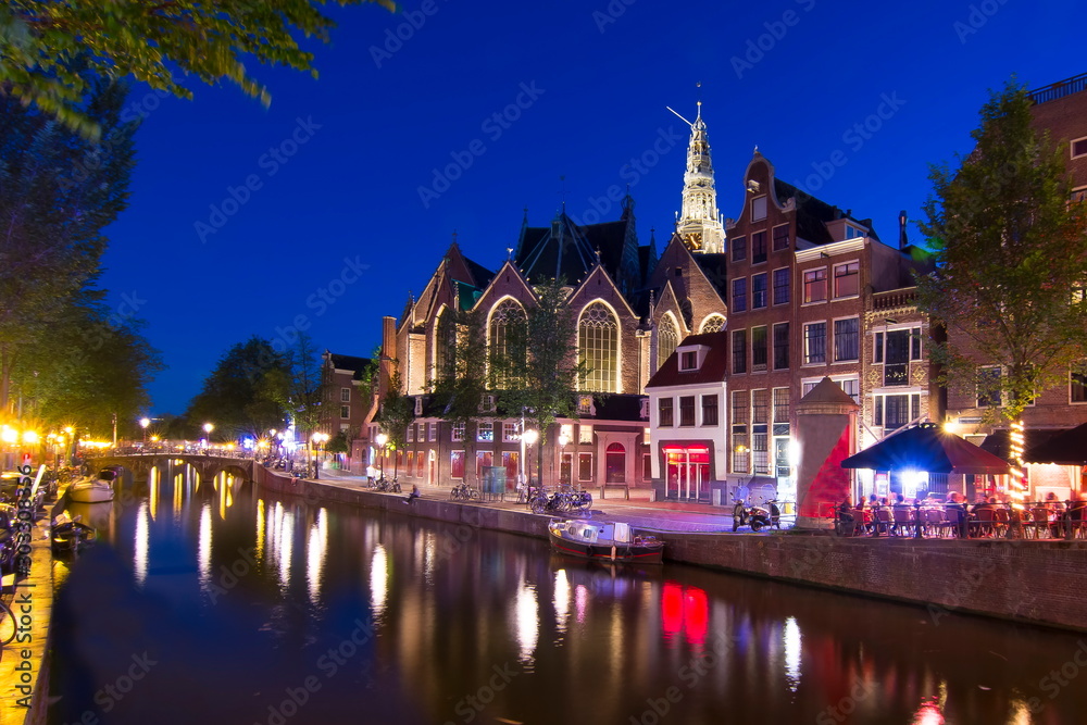 Old Church (Oude Kerk) and Amsterdam canals at night, Netherlands