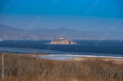 Island on the background of the seascape. Vladivostok, Russia