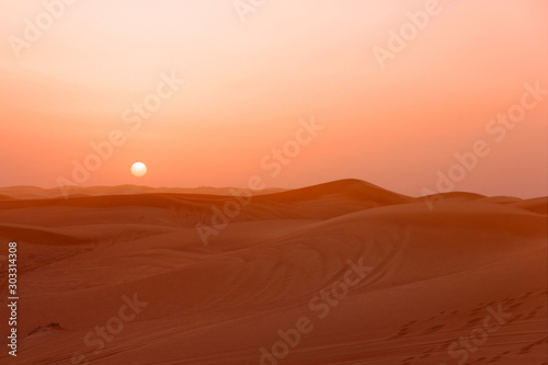 Sand desert sunset landscape view, picturesque landscape with sun, UAE. © Travel Faery