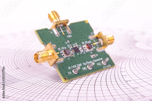 Radio frequency mixer PCB in front of Smith chart
