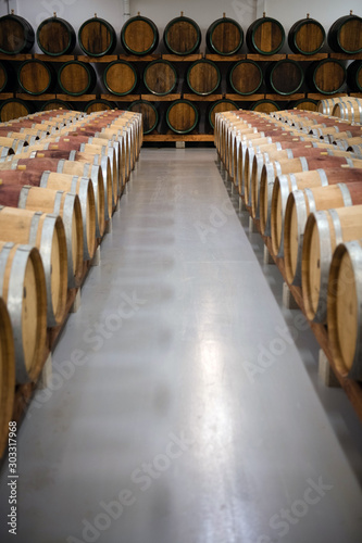 Wooden wine barrels for storage in wine cellar