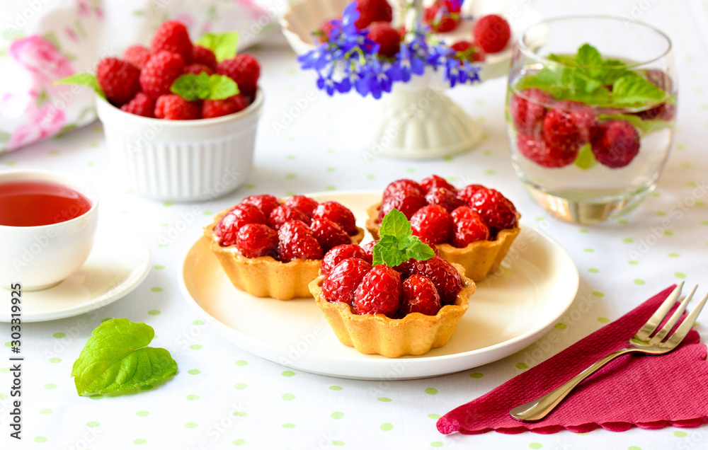 Homemade tartlets with raspberries fruits Homemade tartlets with raspberries fruits