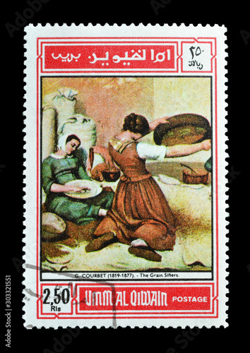Cancelled postage stamp printed by Umm Al Qiwain, United Arab Emirates, that shows Painting  by Courbet, circa 1968. photo