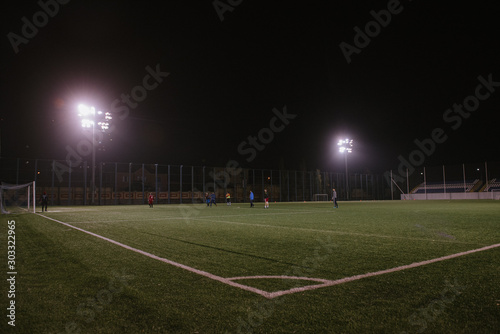 Photo of a soccer stadium at night