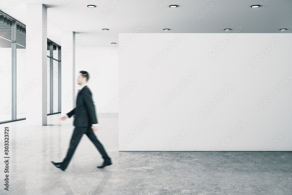 Fototapeta premium Businessperson in gallery with poster