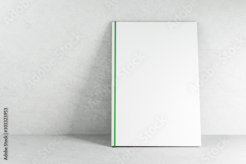 Empty white book on concrete wallpaper