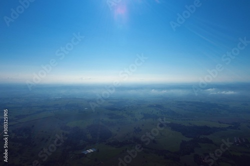 Aerial view of agriculture field with blue sky. Great landscape.