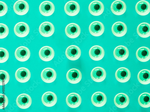 Green eyes pattern on green background