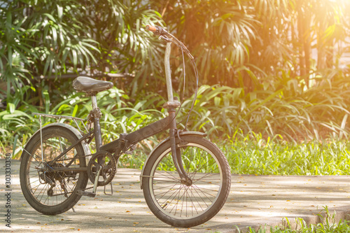 A bicycle in public park. Urban health concept. Copy space wallpaper.