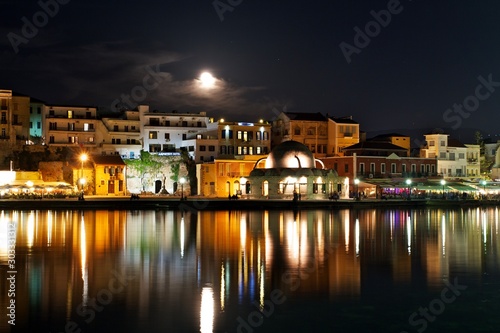 Chania town skyline at night with full moon, Crete, Greece