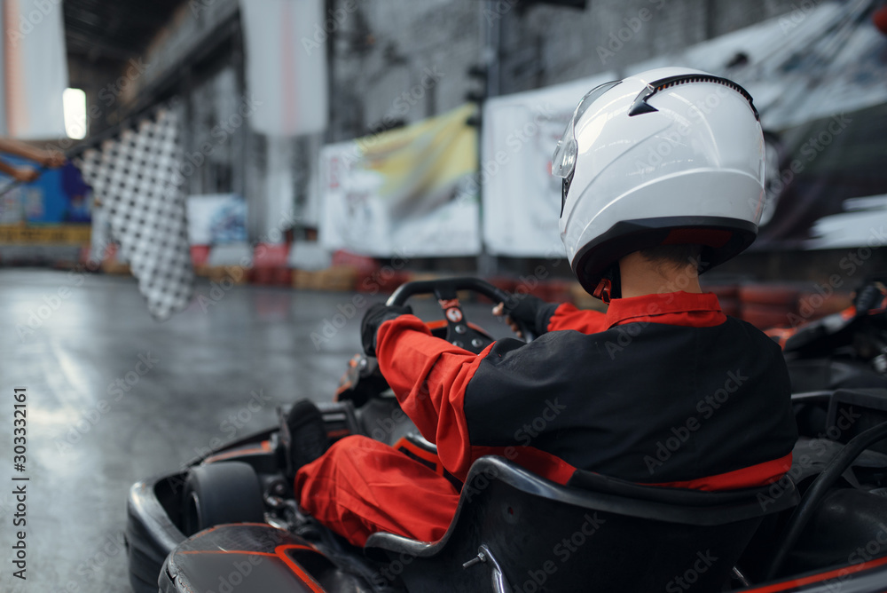 Kart racers in helmet, back view, karting - obrazy, fototapety, plakaty 