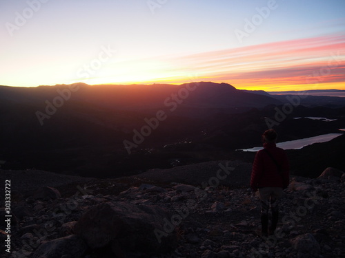 A woman hiker watching the beautiful sunrise, Precious scenery created by nature, Mount Fitz Roy, Los Glaciares National Park near El Chalten, Patagonia, Argentina