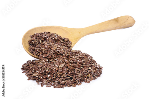 Flax seeds, linseed pile with wooden spoon isolated on white background.Organic food concept
