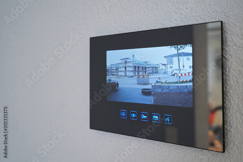 Intercom with video image mounted on the wall in the house. Close-up photo