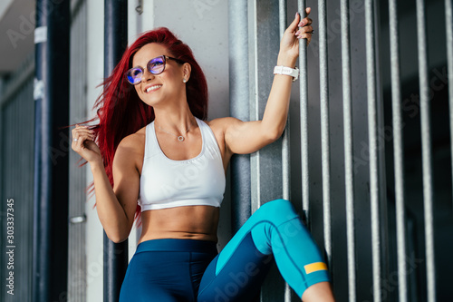 Portrait of healthy fitness girl smiling and working out