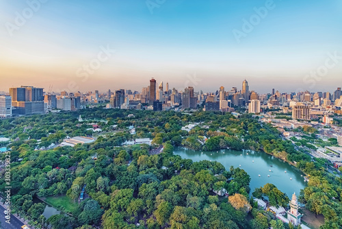 Lumphini Park and skyscrapers in Bangkok city, Thailand