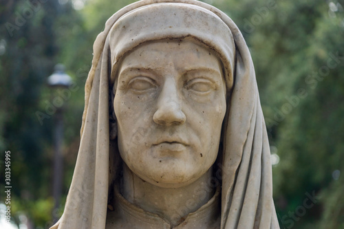 Old marble bust of Giotto in the public park Pincian Hill, Villa Borghese gardens, Rome, Italy photo